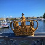 Gilded crown on Skeppsholmsbron with Strandvägen in the background, Stockholm, Sweden