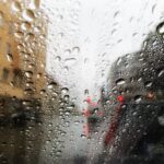 Driving in the rain – watching the red lights through the windshield